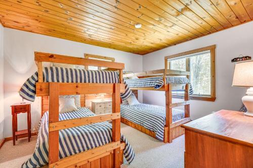a bedroom with three bunk beds in a cabin at Family-Friendly Ludlow Cabin on Lake Pauline! in Ludlow