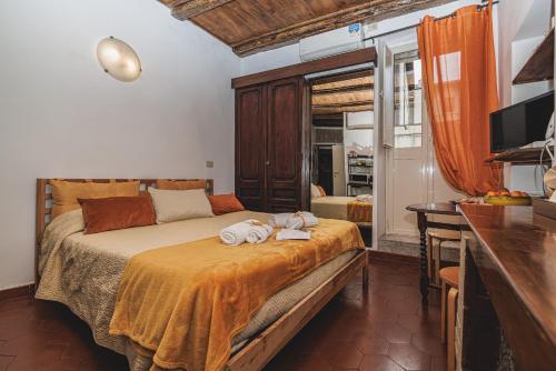Posteľ alebo postele v izbe v ubytovaní Campo De Fiori - Casa Pettinari 78
