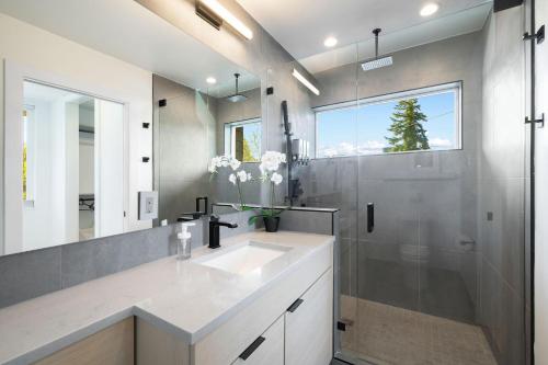a bathroom with a sink and a shower at Wallingford Getaway in Seattle