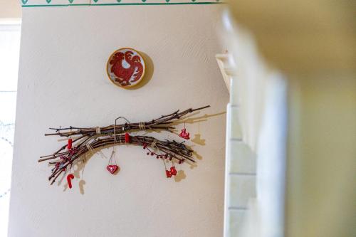 a bunch of branches hanging on a wall at House Mikin Dol in Draž