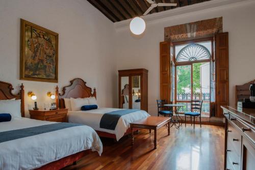 Postel nebo postele na pokoji v ubytování Hotel Los Juaninos