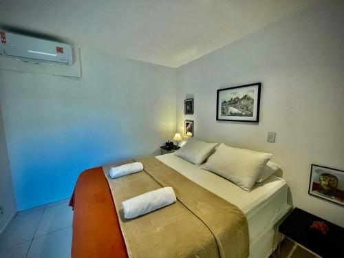 En eller flere senge i et værelse på JTR Jatiúca Trade Residence