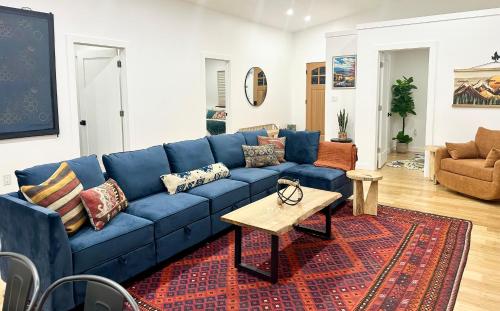 a blue couch in a living room with a table at Sauger home in Saugerties