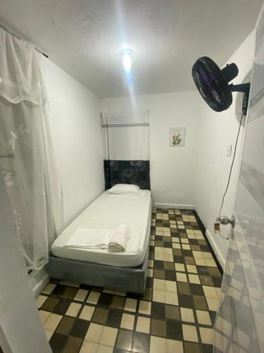 Postel nebo postele na pokoji v ubytování Hostal Familiar