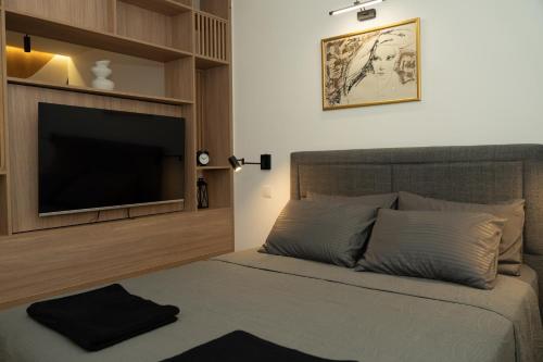 Postel nebo postele na pokoji v ubytování Aster Apartmani