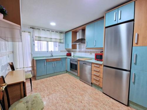 Kuchyň nebo kuchyňský kout v ubytování Apartamento Sanchiz
