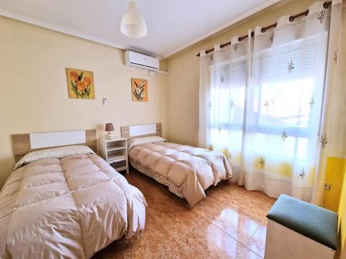 Postel nebo postele na pokoji v ubytování Apartamento Sanchiz