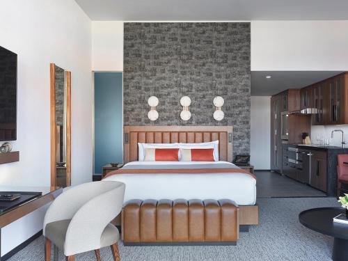 a bedroom with a large bed and a kitchen at Black Desert Resort in Ivins
