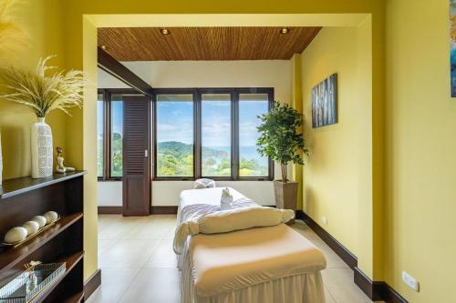 a hospital room with a bed and a window at 360 Splendor 206-Ocean View Condo-Breakfast Included! in Playa Flamingo