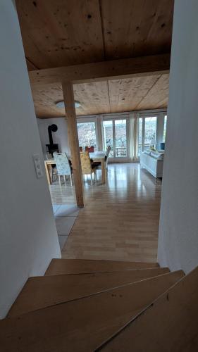 a view of a living room with a wooden ceiling at Casa14 - Swiss houses in Steffisburg