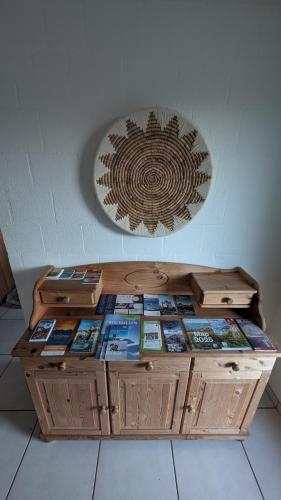 a wooden table with books on top of it at Casa14 - Swiss houses in Steffisburg