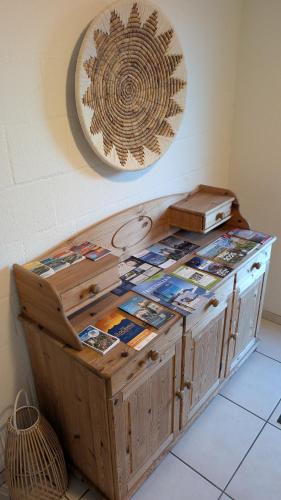 a wooden cabinet with books on top of it at Casa14 - Swiss houses in Steffisburg
