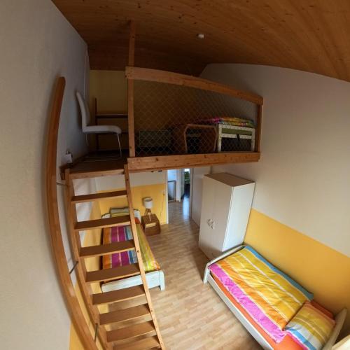 an overhead view of a room with bunk beds at Casa14 - Swiss houses in Steffisburg