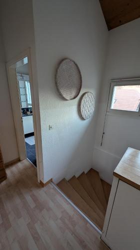 an empty room with a door and a window at Casa14 - Swiss houses in Steffisburg