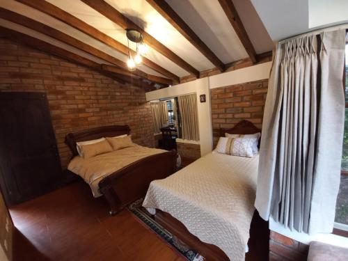 Postel nebo postele na pokoji v ubytování La Posada del Chagra HOST