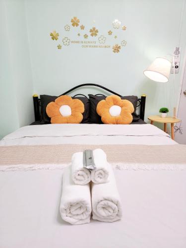 a bedroom with a bed with towels on it at 202-STP Homely room Free Wi-Fi and Near BTS in Sathani Bang Khen