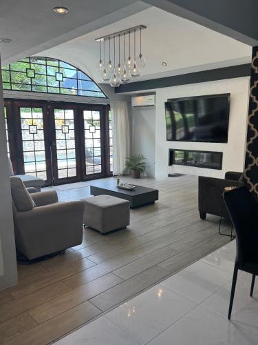 a living room with a couch and a table at home away from home in Diego Martin