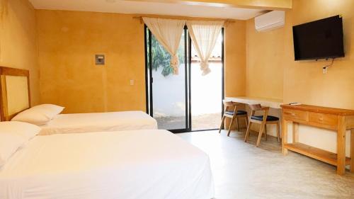 Ένα ή περισσότερα κρεβάτια σε δωμάτιο στο Casa Eve room 4