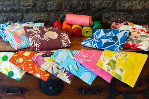a group of ties sitting on a wooden table at Senkeien Tsukioka Hotel in Kaminoyama