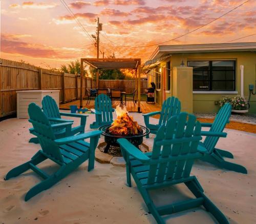 a group of chairs sitting around a fire pit at Family Friendly Home Near Beach and Downtown in Clearwater
