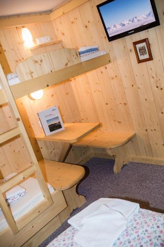Ein Bett oder Betten in einem Zimmer der Unterkunft Alpengasthof Paletti