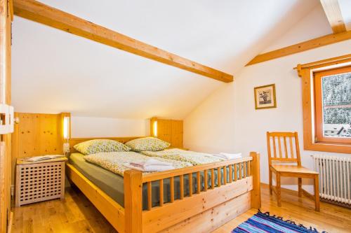 Ein Bett oder Betten in einem Zimmer der Unterkunft Alpengasthof Paletti