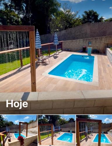 a swimming pool in a backyard with a fence at Cabanas Cantareira - Araucária in Mairiporã