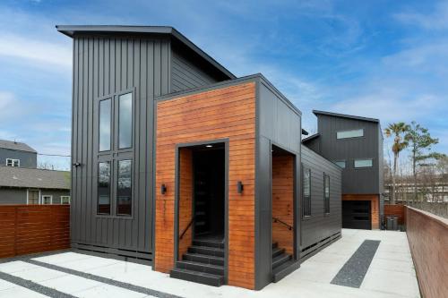 a contemporary house with a black and orange facade at Urban Oasis with Top Houston Attractions nearby in Houston