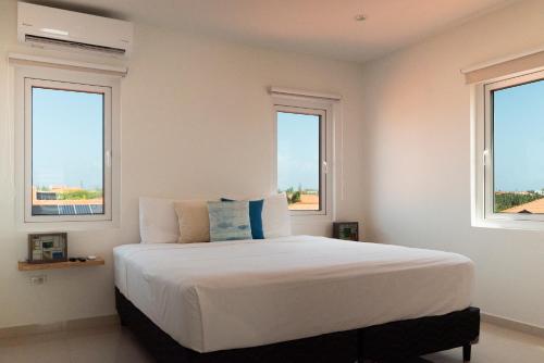 Кровать или кровати в номере Beach Homes Aruba