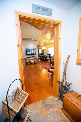 a living room with a door open to a living room at Cozy Tahoe Donner Retreat in Truckee