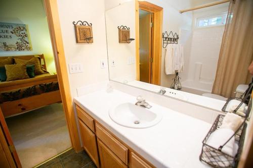 a bathroom with a sink and a mirror at Cozy Tahoe Donner Retreat in Truckee