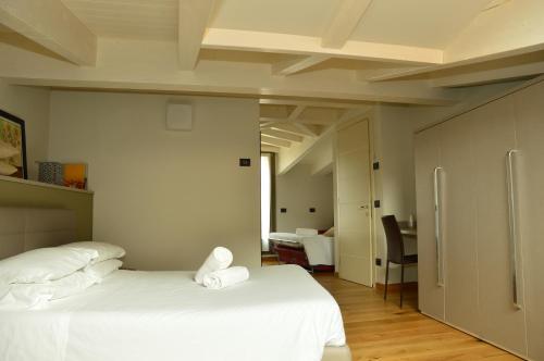 Postel nebo postele na pokoji v ubytování Locanda Blum In
