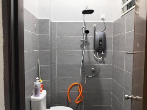 a shower stall in a bathroom with a toilet at D'Sara Homestay Fully Furnished 3 bedrooms All Aircond 2 miles centre in Kemaman