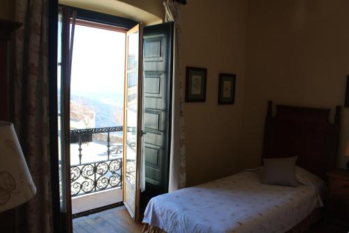 Ένα ή περισσότερα κρεβάτια σε δωμάτιο στο Casa da Arvore