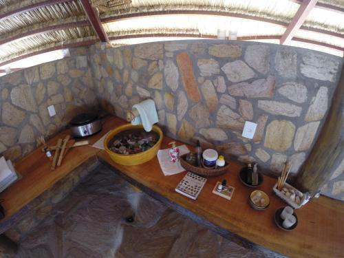 an overhead view of a table in a tiny house at Oasis Tajaja Pousada in Jacumã