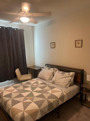 a bedroom with a bed and a ceiling fan at Chic 1BHK Haven Quiet & Relaxing Near Austin in Cedar Park