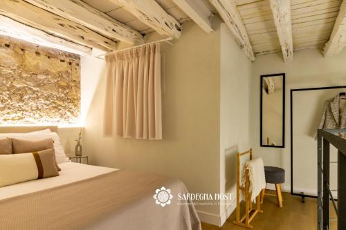 Postel nebo postele na pokoji v ubytování Sardegna Host Il Nido