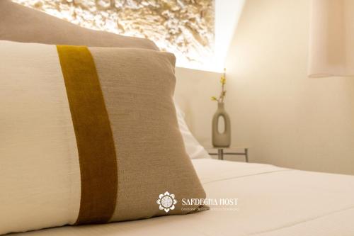Postel nebo postele na pokoji v ubytování Sardegna Host Il Nido
