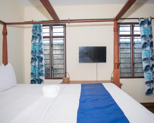 Katil atau katil-katil dalam bilik di Swahili villa