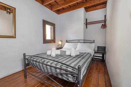 a bedroom with a bed with white pillows at Saint Michel Hotel in Rhodes Town