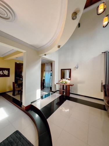 a living room with white walls and a ceiling at Bigcity Villa - Airport Transit Hotel in Katunayake