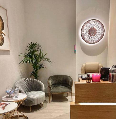 a waiting room with two chairs and a table at Hyatt Centric Jumeirah Dubai in Dubai