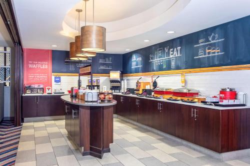 a fast food restaurant with a counter with food at Hampton Inn Orlando-International Airport in Orlando