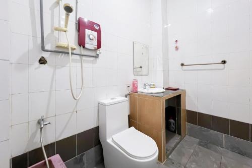 a bathroom with a white toilet and a shower at Homestay Taman U12, Shah Alam - Smarthome in Shah Alam