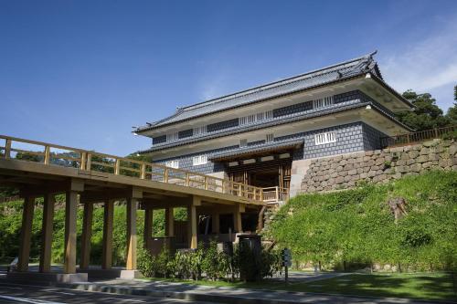 a building with a bridge in front of it at Tokyu Stay Kanazawa in Kanazawa