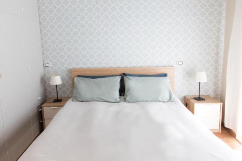 En eller flere senge i et værelse på Casa Luce