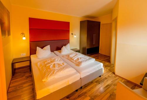 Ένα ή περισσότερα κρεβάτια σε δωμάτιο στο Zimmer am See - 02