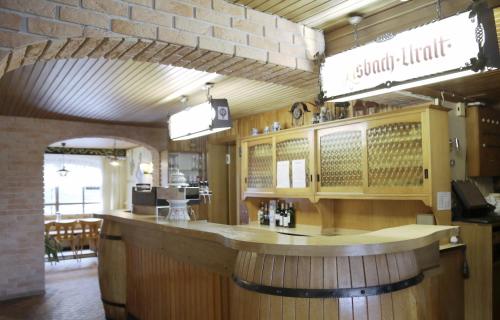 a bar inside of a restaurant with a counter at Zum Burgkeller in Bruchweiler