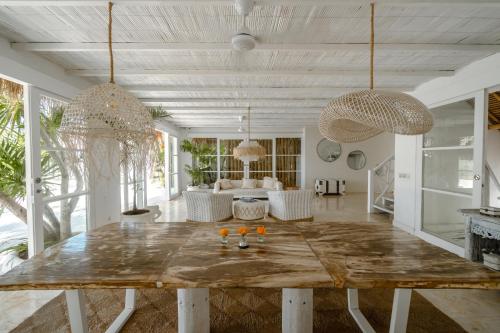 a living room with a large table with glasses on it at Gravity Boutique Suites in Uluwatu