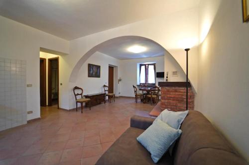 a living room with a couch and a table at Villa Adelaide 22 Pax by VILLASRETREATS in Rometta
